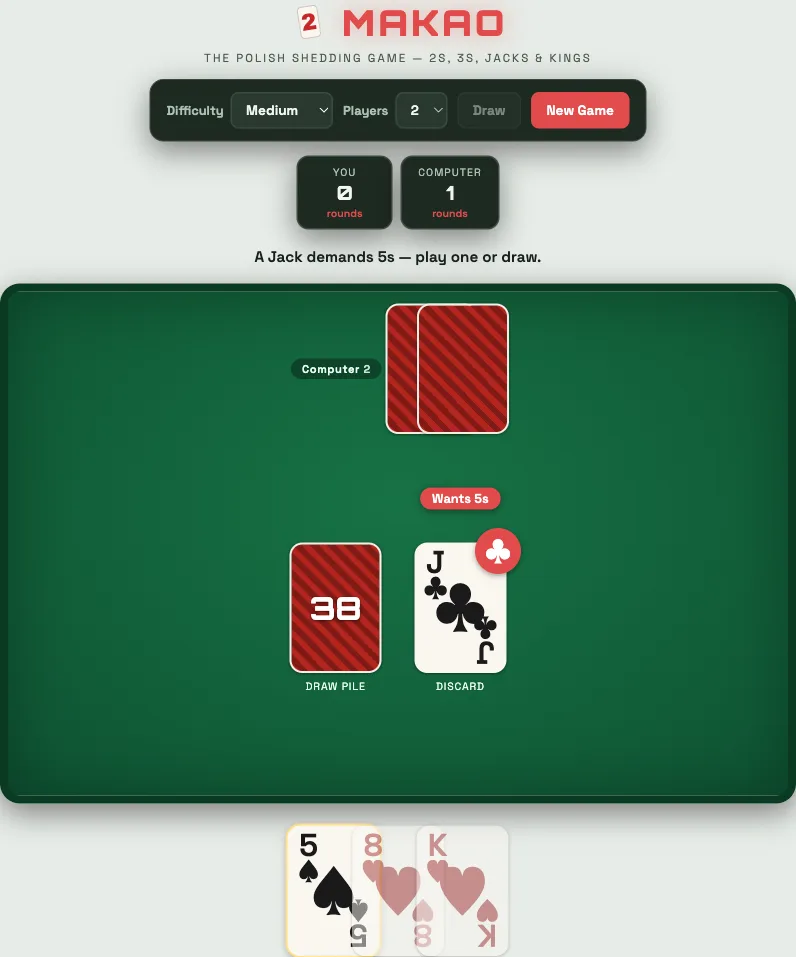 The Makao card game against the computer. A jack is on the discard pile and a banner reads “Wants 5s”; the status line says a Jack demands 5s, so the player must play a 5 or draw.
